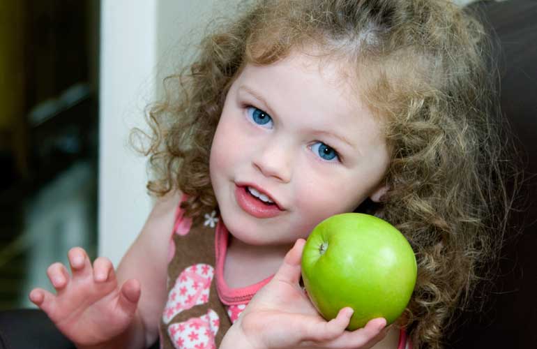 Child with apple.